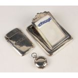 An Edwardian silver mounted desk notepad and clip, the hinged sloping front inset with an '