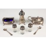 An Elizabeth II silver condiment set, comprising mustard, salt and pepper with plated top,