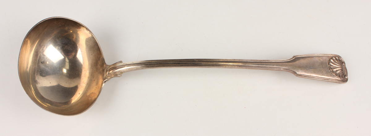 An early Victorian silver Fiddle, Thread and Shell pattern soup ladle, London 1860 by Chawner &