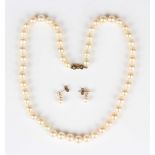 A single row necklace of uniform cultured pearls on a 9ct gold clasp, length 45.5cm, and a pair of