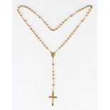 A gold rosary with pendant crucifix, detailed '750', length 3cm, the neckchain spaced with spherical