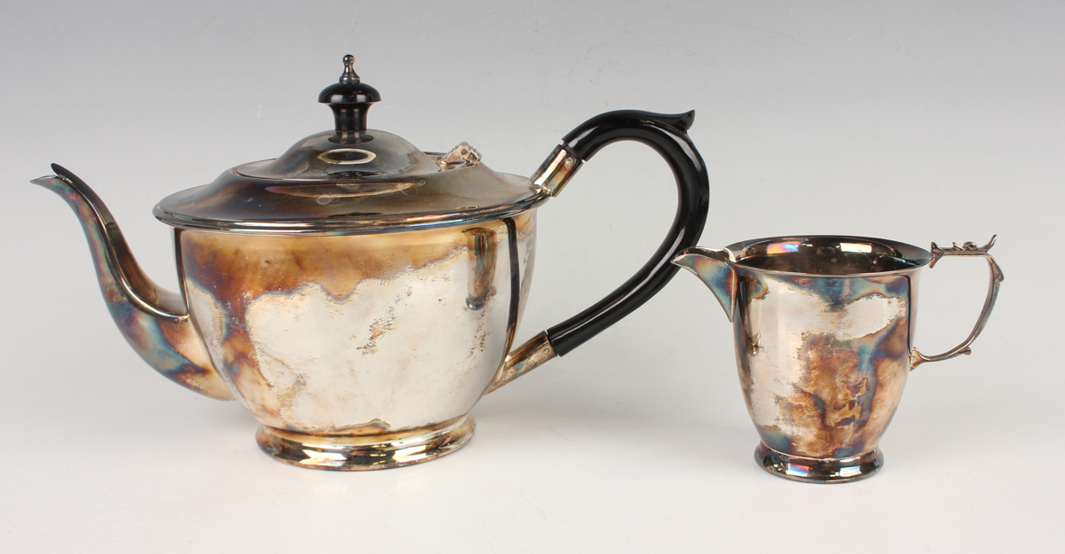 An Elizabeth II silver circular teapot and matching milk jug, Birmingham 1979 by J.T. Deeley Ltd,