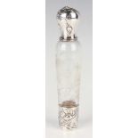 An early 20th century French silver mounted clear glass lady's travelling flask, the silver screw