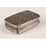 A George IV silver rectangular vinaigrette, the hinged lid engraved with foliate scrolls revealing a