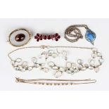 A foil backed flat cut garnet brooch, unmarked, width 4.5cm, a gold and moonstone necklace,