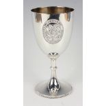 An Edwardian silver trophy goblet, the 'U' shaped body applied with the 'London Athletic Club'
