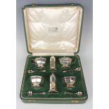 A George V silver six-piece condiment set, comprising a pair of salts, peppers and mustards, each of