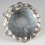 A George II silver salver, the centre engraved with a monogram within a raised scroll and
