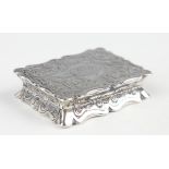 A Victorian silver shaped rectangular vinaigrette, engraved with scrolls, the hinged lid