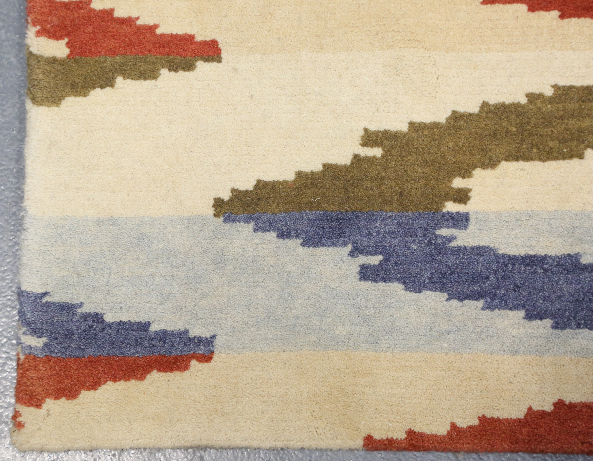 A contemporary design rug, modern, the ivory field with geometric polychrome bands, 180cm x 125cm. - Image 3 of 9