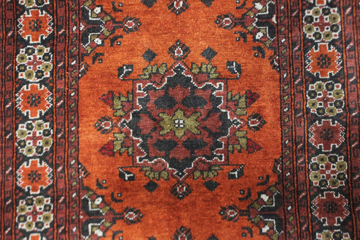 A small Afghan rug, modern, the terracotta field with two medallions, 144cm x 96cm.Buyer’s Premium - Image 5 of 5