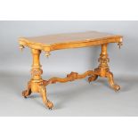 A Victorian bird's eye maple serpentine shaped centre table, raised on carved baluster supports