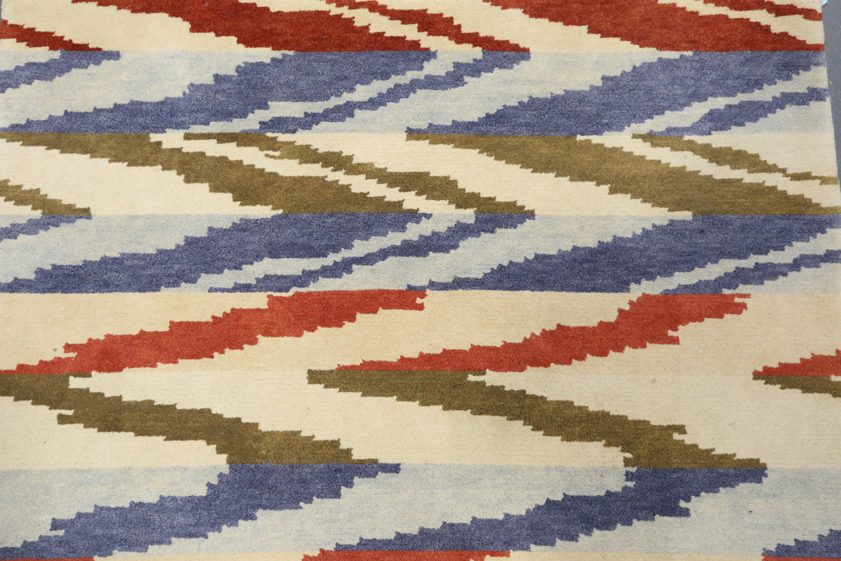 A contemporary design rug, modern, the ivory field with geometric polychrome bands, 180cm x 125cm. - Image 9 of 9