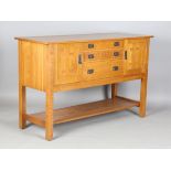 An American Arts and Crafts style quarter-sawn oak sideboard by L. & J.G. Stickley, with patinated