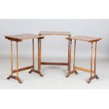 An early 20th century French rosewood and floral inlaid nest of occasional tables, each top inlaid