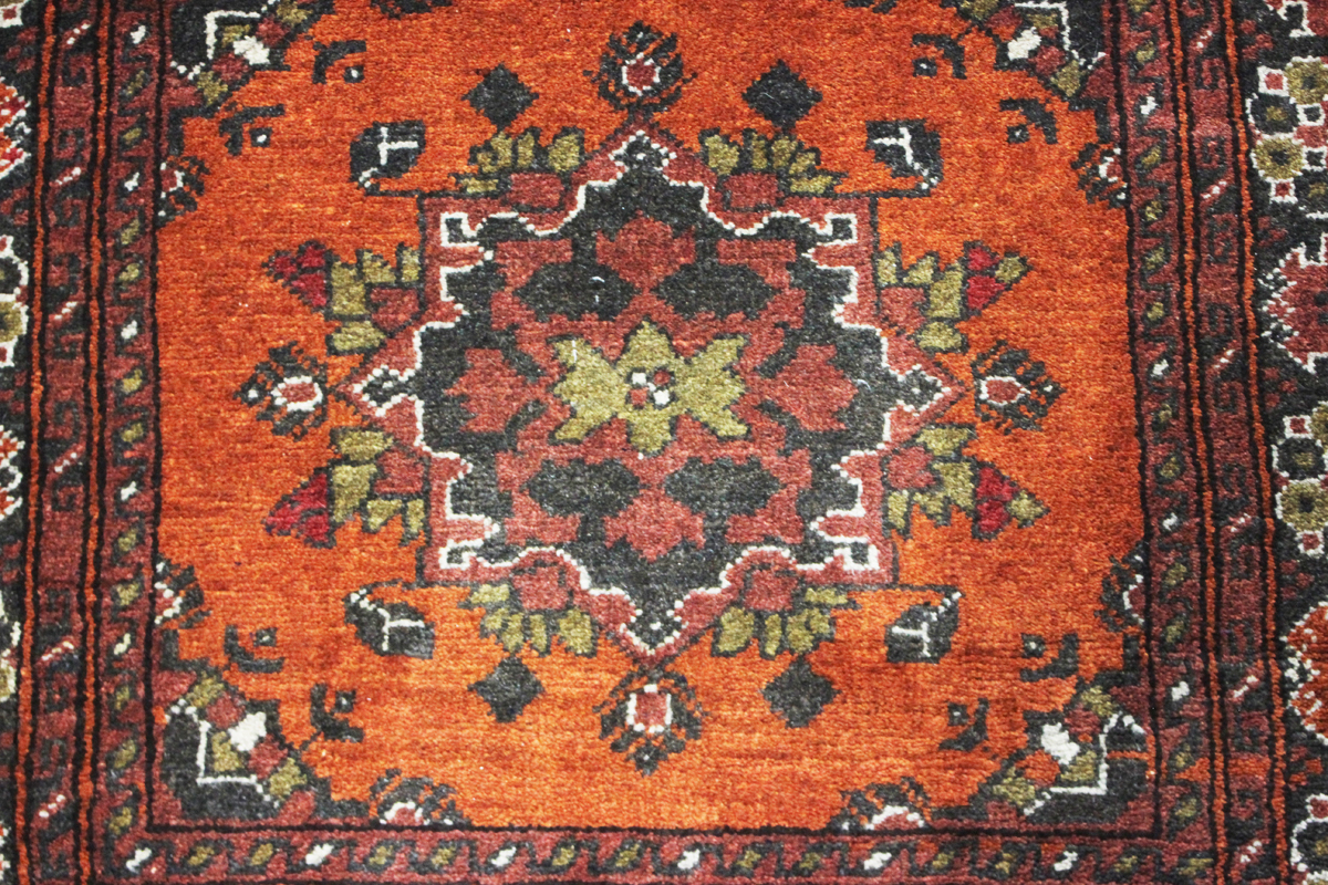 A small Afghan rug, modern, the terracotta field with two medallions, 144cm x 96cm.Buyer’s Premium - Image 4 of 5