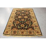 An Indian rug, modern, the black field with overall palmettes, within a complimentary border,