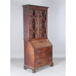 A George III mahogany bureau bookcase with ebony stringing, height 216cm, width 99cm, depth 52cm (