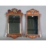 Two similar George III walnut fretwork wall mirrors with carved giltwood bird surmounts, height