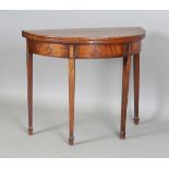 A George III mahogany demi-lune fold-over card table with tulipwood crossbanding and inlaid