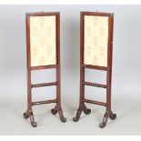 A pair of William IV mahogany and brass mounted adjustable firescreens, fitted with rising and