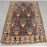 A Beluche rug, Afghan/Persian borders, early 20th century, the blue field with overall stylized