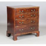 A George III mahogany chest of four graduated oak-lined drawers with original brass handles,