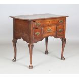 An early George III provincial oak lowboy, the frieze fitted with four drawers, height 72cm, width