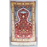 A fine Hereke silk and gilt metal thread prayer rug, Turkey, modern, the deep claret mihrab with