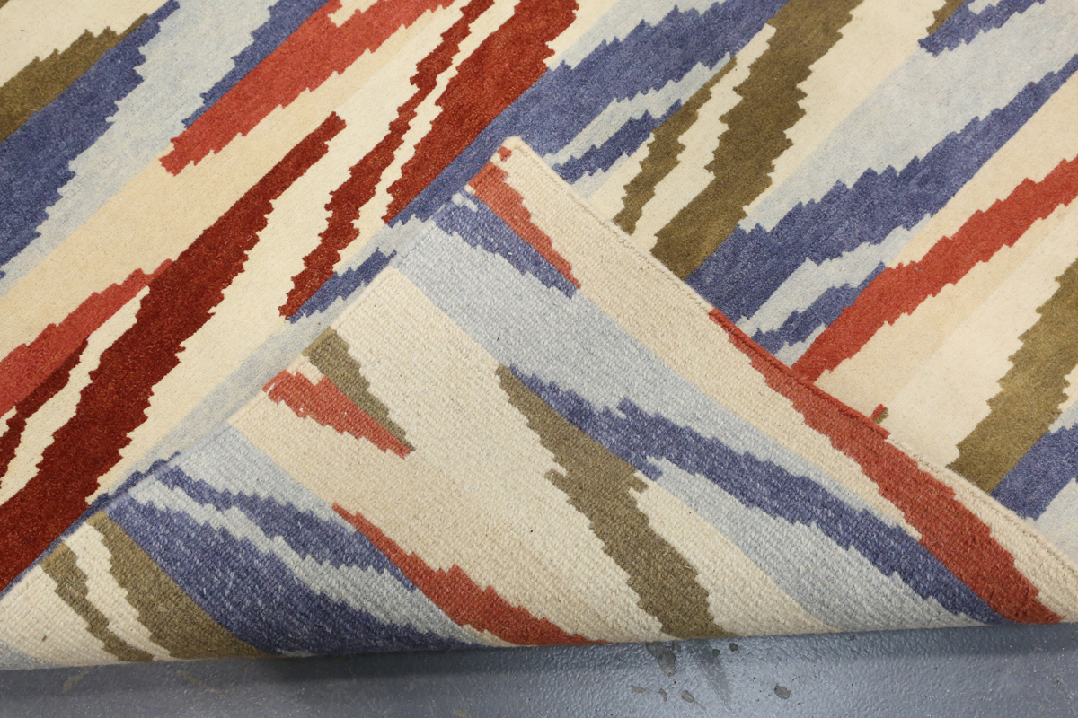 A contemporary design rug, modern, the ivory field with geometric polychrome bands, 180cm x 125cm. - Image 2 of 9