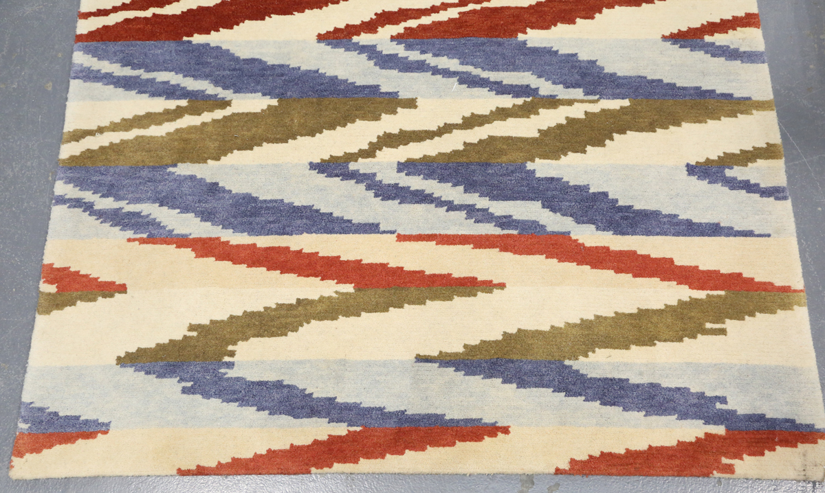 A contemporary design rug, modern, the ivory field with geometric polychrome bands, 180cm x 125cm. - Image 5 of 9