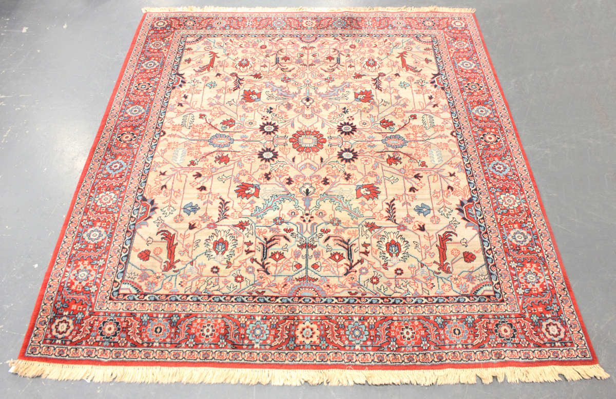 A Belgian 'Heriz' style carpet, late 20th century, the grey/green field with overall palmettes and