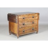 A late Victorian Arts and Crafts stained ash chest of three drawers, with painted line and dot