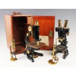 A late 19th century gilt lacquered brass monocular field microscope, within a fitted mahogany box,