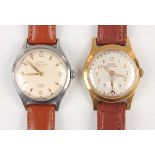 A Rogau Cognac Gautier gilt metal fronted and steel backed gentleman's calendar wristwatch, the