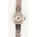A Tegra 9ct white gold and diamond set lady's dress bracelet wristwatch, the signed circular