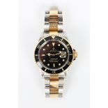 A Rolex Oyster Perpetual Date Submariner stainless steel and yellow gold gentleman's bracelet