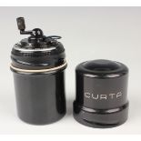A Curta calculator, Type 1, by Contina Ltd Mauren, No. 41009, height 10.5cm, within a signed black