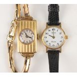 An 18ct gold rectangular cased lady's wristwatch, the silvered circular dial with Arabic hour