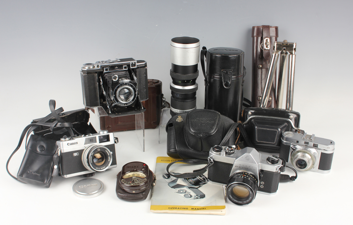 A small group of assorted cameras and accessories, including a Pentax SP500 camera with Super-