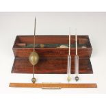 A George III brass hydrometer with four weights and boxwood slide rule, by Robert Atkins of 136