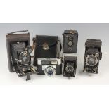 A small group of five cameras, including a Zeiss Ikon Box-Tengor, a Zeiss Ikon Baby Konta 520/18,