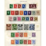 A George VI Crown album (affected by damp), two New Age albums of British Commonwealth stamps used