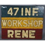 A collection of mid-20th century militaria, including a painted wood sign for the '47 Inf.