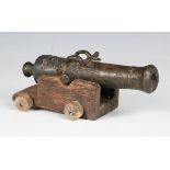 An early 18th century bronze signal or saluting cannon of typical form with serpent-head carrying
