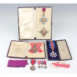 A K.B.E. enamelled neck badge and breast star with Garrard & Co fitted case, a C.B.E.L. lady's