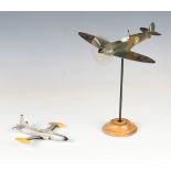 An International Model Aircraft Ltd model of a Supermarine Spitfire, wingspan 23.5cm, mounted on a