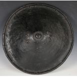 A large late 19th/early 20th century North African rhinoceros hide shield of circular form with