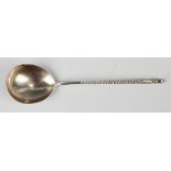 A 19th century Russian silver spoon, 84 zolotnik, the fig shaped bowl back engraved with foliate