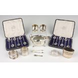 A pair of Victorian silver salts of tapered squat circular form, each engraved with floral garlands,